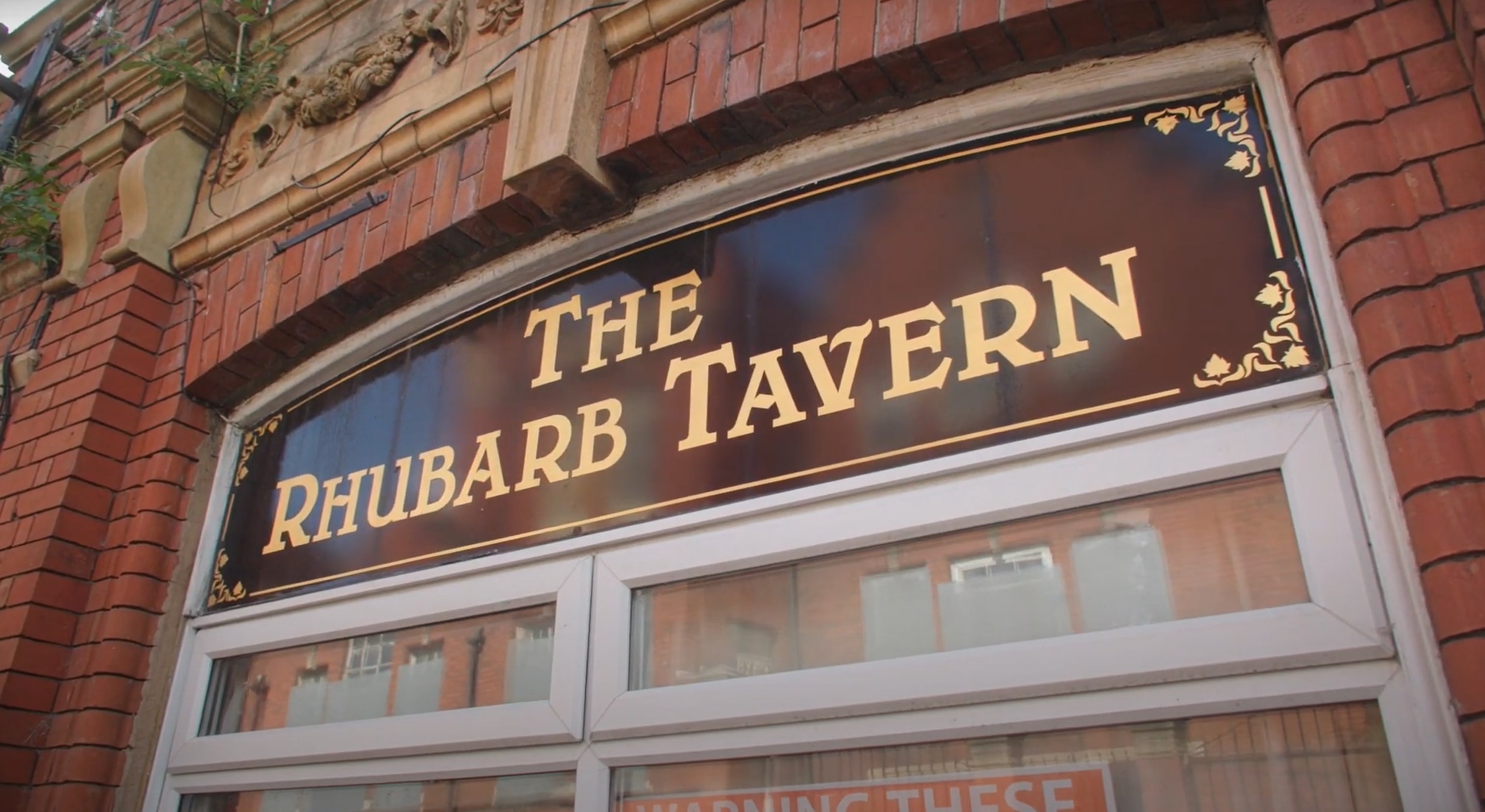 The Rhubarb sign above a window